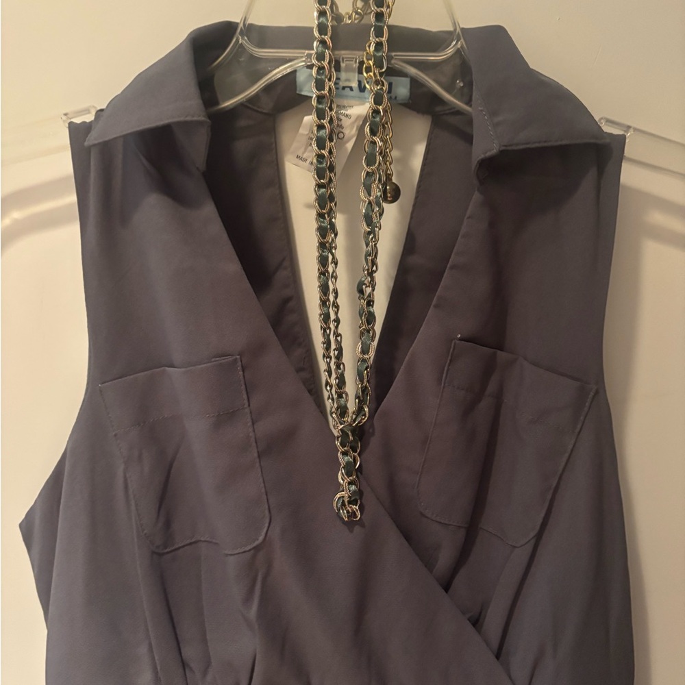 Chic Gray Sleeveless Blouse with Chain Necklace